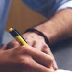 Student transcribing a note