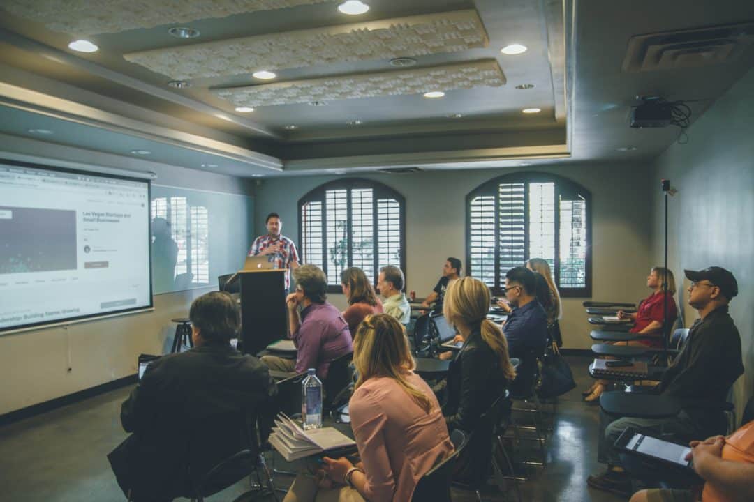 Students during lecture with audiovisual media on display