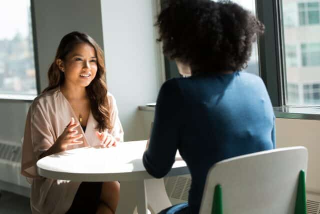 Two women conducting a qualitative interview