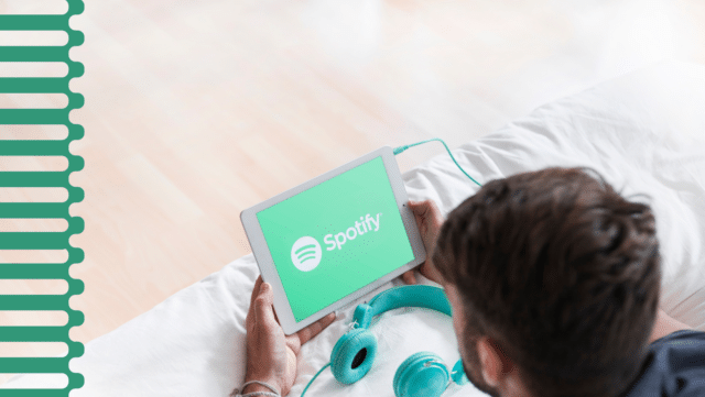 A guy launching the Spotify app on his iPad.